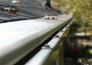 Close up of a seamless gutter system with gutter guards